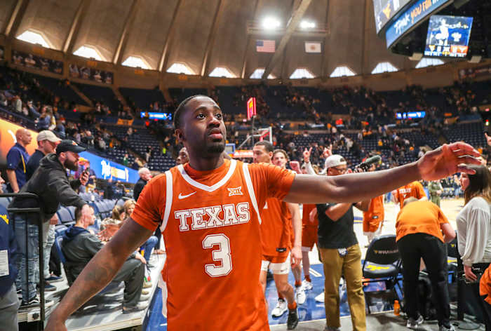 Feb 26, 2022; Morgantown, West Virginia, USA; Texas Longhorns guard Courtney Ramey (3) celebrates with fans after defeating the West Virginia Mountaineers at WVU Coliseum. Mandatory Credit: Ben Queen-USA TODAY Sports